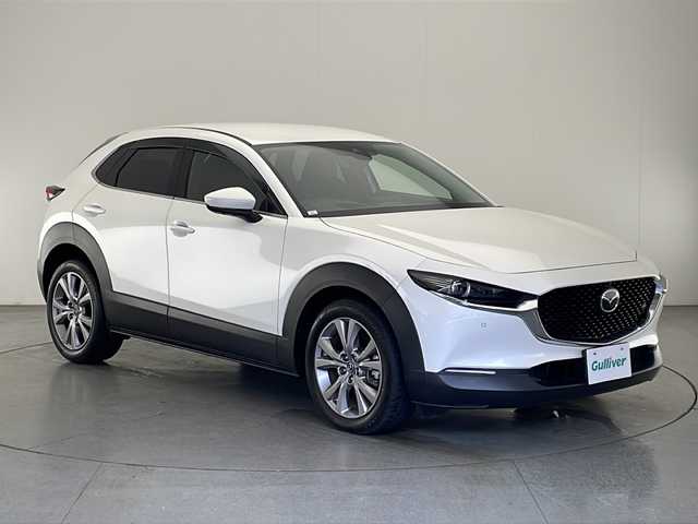 マツダ ＣＸ－３０ XD Lパッケージ 宮崎県 2020(令2)年 2.8万km スノーフレイクホワイトパールマイカ 禁煙車/衝突被害軽減ブレーキ/純正8.8型ディスプレイオーディオナビTV/（CD/DVD/Bluetooth/FMAM/フルセグTV)/純正バックカメラ/純正ETC/純正LEDオートライト/純正LEDフォグ/純正16インチアルミ/純正フロアマット/全方位モニター/茶本革シート/アダプティブクルーズコントロール/レーンディパーチャーアラート/ブラインドスポットモニター/クリアランスソナー/ヘッドアップディスプレイ/パワーバックドア/前席パワーシート/シートヒーター/ステアリングヒーター/本革巻ハンドル/パドルシフト/スマートキー/プッシュエンジンスタート/スペアキー/取扱い説明書/ナビ取扱い説明書