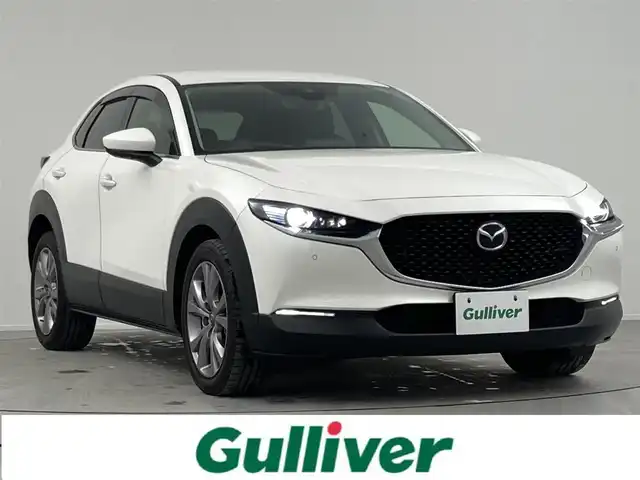 マツダ ＣＸ－３０ XD Lパッケージ 熊本県 2020(令2)年 2.8万km スノーフレイクホワイトパールマイカ 禁煙車/衝突被害軽減ブレーキ/純正8.8型ディスプレイオーディオナビTV/（CD/DVD/Bluetooth/FMAM/フルセグTV)/純正バックカメラ/純正ETC/純正LEDオートライト/純正LEDフォグ/純正16インチアルミ/純正フロアマット/全方位モニター/茶本革シート/アダプティブクルーズコントロール/レーンディパーチャーアラート/ブラインドスポットモニター/クリアランスソナー/ヘッドアップディスプレイ/パワーバックドア/前席パワーシート/シートヒーター/ステアリングヒーター/本革巻ハンドル/パドルシフト/スマートキー/プッシュエンジンスタート/スペアキー/取扱い説明書/ナビ取扱い説明書