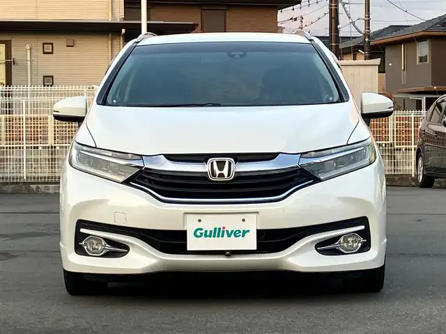 ホンダ シャトル ハイブリッド Z 静岡県 2015(平27)年 4.2万km ホワイトオーキッドパール 純正ナビ(CD/DVD/BT/フルセグ)/バックカメラ/ドライブレコーダー前後・全方位/ETC/エンジンスタートボタン/パワーステアリング/パワーウィンドウ/アイドリングストップ/パドルシフト/寒冷地仕様/保証書/取扱説明書/スマートキー/スペアキー１本/クルーズコントロール/純正フロアマット/ハーフレザーシート/D席N席シートヒーター/ルーフレール/純正アルミホイール/ABS/横滑り防止装置/オートライト/LEDヘッドライト/W+サイドエアバッグ/カーテンエアバッグ/衝突軽減システム/デジタルインナーミラー
