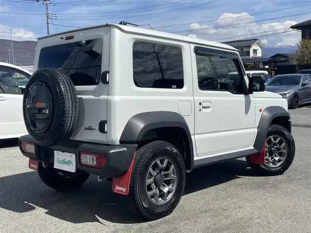 スズキ ジムニー シエラ JC 山梨県 2022(令4)年 2万km ピュアホワイトP パートタイム4WD/純正ナビ（CN-RZ876）/CD/DVD/Bluetooth/TV/バックカメラ/クルーズコントロール/ETC/ドライブレコーダー/純正アルミホイール/スペアキー1本/スマートキー/プッシュスタート/アイドリングストップ/横滑り防止装置/車線逸脱抑制機能/取扱説明書