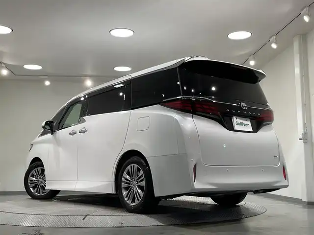 トヨタ アルファードハイブリット Z 愛知県 2023(令5)年 2.2万km プラチナホワイトパールマイカ 左右独立ムーンルーフ　/純正フリップダウンモニター　/純正１４インチディスプレイオーディオＰｌｕｓ　/（Bluetooth/フルセグTV/USB/FM/AM)/トヨタチームメイト/　-アドバンスパーク＋パーキングサポートブレーキ/トヨタセーフティセンス　/　-プリクラッシュセーフティ/　-レーントレーニングアシスト(LDA)/　-レーダークルーズコントロール(ACC)/　-オートマチックハイビーム/　-ロードサインアシスト/デジタルインナーミラー　/パノラマミックビューモニター/ビルトインETC2.0/前後ドライブレコーダー/両側パワースライドドア/ブラインドスポットモニター/AC100V/置くだけ充電/電動パワーシート/快適温熱シート＋ベンチレーション