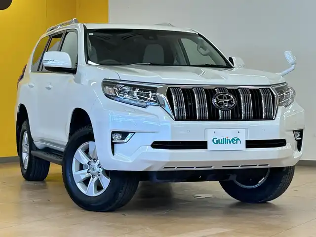 トヨタ ランドクルーザー プラド TX 群馬県 2023(令5)年 2.4万km ホワイトパールクリスタルシャイン トヨタセーフティセンス/・プリクラッシュセーフティ/・レーンディパーチャーアラート/・クリアランスソナー/・ロードサインアシスト/・レーダークルーズコントロール/・先行車発進告知/サンルーフ/純正SDナビ/・フルセグTV/・Bluetooth/・DVD/CD/SD/HDMI/・FM/AM/社外後席モニター/バックカメラ/ビルトインETC/革巻きステアリング/ステアリングスイッチ/スマートキー/プッシュスタート/LEDヘッドライト/フォグランプ/オートライト/オートマチックハイビーム/ヘッドライトウォッシャー/純正17インチAW/フロアマット/電動格納ウィンカーミラー/横滑り防止機能