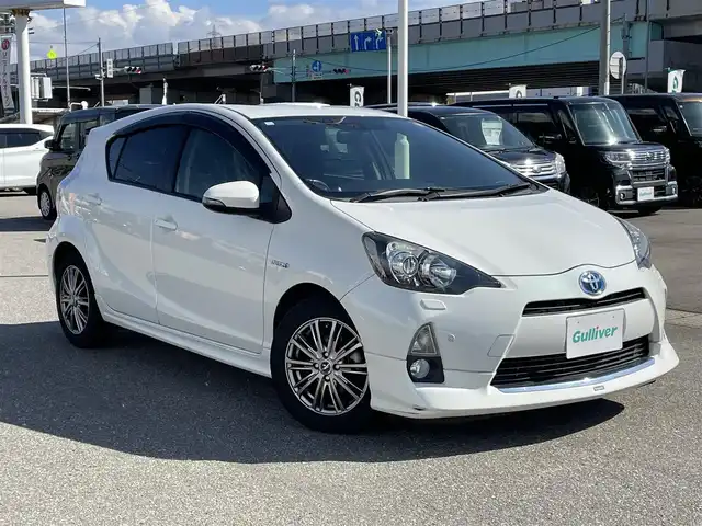 トヨタ アクア G 石川県 2014(平26)年 7.1万km パール 純正メモリーナビ/純正CD/DVD/フルセグTV/バックカメラ/ETC/スマートキー/プッシュスタート/電動ミラー/モデリスタエアロ/モデリスタマフラー/社外アルミホイール/ステアリングスイッチ/保証書