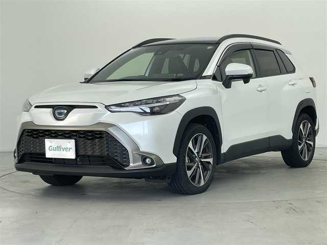 トヨタ カローラ クロス ハイブリッド Z 群馬県 2023(令5)年 1.6万km プラチナホワイトパールマイカ パノラマルーフ　純正９インチディスプレイオーディオナビ（Bluetooth/Miracast/USB/AM/FM）　バックカメラ　パワーバックドア　D+N席シートヒーター　D席パワーシート　ETC　AC１００V　トヨタセーフティセンス　プリクラッシュセーフティ　レーントレーシングアシスト　パーキングサポートブレーキ　クリアランスソナー　ロードサインアシスト　レーダークルーズコントロール　オートハイビーム　プッシュスタート　スマートキー　電動パーキングブレーキ　社外アルミホイール付スタッドレスタイヤ積込　ワンオーナー