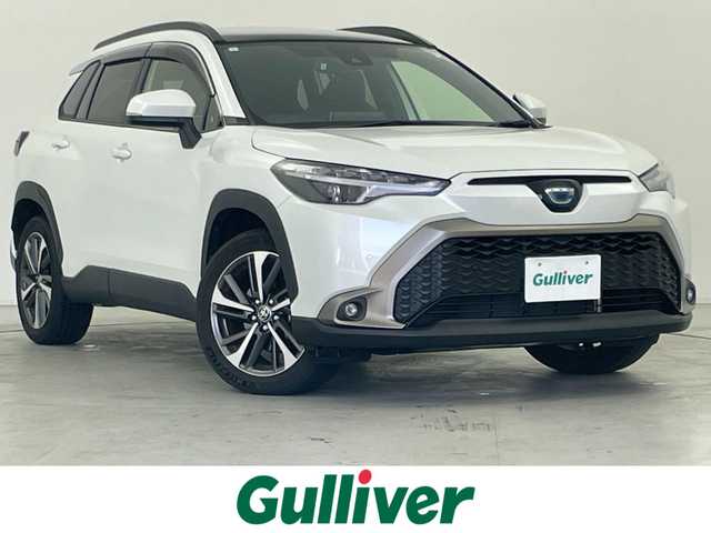 トヨタ カローラ クロス ハイブリッド Z 群馬県 2023(令5)年 1.6万km プラチナホワイトパールマイカ パノラマルーフ　純正９インチディスプレイオーディオナビ（Bluetooth/Miracast/USB/AM/FM）　バックカメラ　パワーバックドア　D+N席シートヒーター　D席パワーシート　ETC　AC１００V　トヨタセーフティセンス　プリクラッシュセーフティ　レーントレーシングアシスト　パーキングサポートブレーキ　クリアランスソナー　ロードサインアシスト　レーダークルーズコントロール　オートハイビーム　プッシュスタート　スマートキー　電動パーキングブレーキ　社外アルミホイール付スタッドレスタイヤ積込　ワンオーナー