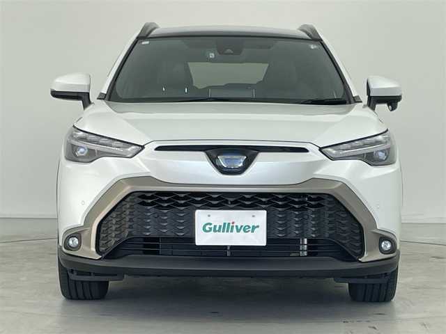 トヨタ カローラ クロス ハイブリッド Z 群馬県 2023(令5)年 1.6万km プラチナホワイトパールマイカ パノラマルーフ　純正９インチディスプレイオーディオナビ（Bluetooth/Miracast/USB/AM/FM）　バックカメラ　パワーバックドア　D+N席シートヒーター　D席パワーシート　ETC　AC１００V　トヨタセーフティセンス　プリクラッシュセーフティ　レーントレーシングアシスト　パーキングサポートブレーキ　クリアランスソナー　ロードサインアシスト　レーダークルーズコントロール　オートハイビーム　プッシュスタート　スマートキー　電動パーキングブレーキ　社外アルミホイール付スタッドレスタイヤ積込　ワンオーナー