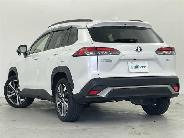 トヨタ カローラ クロス ハイブリッド Z 群馬県 2023(令5)年 1.6万km プラチナホワイトパールマイカ パノラマルーフ　純正９インチディスプレイオーディオナビ（Bluetooth/Miracast/USB/AM/FM）　バックカメラ　パワーバックドア　D+N席シートヒーター　D席パワーシート　ETC　AC１００V　トヨタセーフティセンス　プリクラッシュセーフティ　レーントレーシングアシスト　パーキングサポートブレーキ　クリアランスソナー　ロードサインアシスト　レーダークルーズコントロール　オートハイビーム　プッシュスタート　スマートキー　電動パーキングブレーキ　社外アルミホイール付スタッドレスタイヤ積込　ワンオーナー