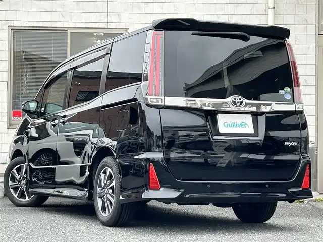 トヨタ ノア Si ダブルバイビーⅡ 福岡県 2019(平31)年 4.3万km ブラック MODELLISTAエアロ（フロント、サイド）/純正10インチメモリナビ【NSZN-Z68T】/　（FM/AM/HDMI/CD/DVD/Bluetooth/フルセグTV）/バックカメラ/純正12インチフリップダウンモニター(リモコン付)【V12T-R68C】/トヨタセーフティーセンス/・プリクラッシュセーフティー/・レーントレーシングサポート/・レーダークルーズコントロール/・レーンディパーチャーアラート/・オートマッチックハイビーム/・パーキングサポートブレーキ/・先行車発進アラーム/クリアランスソナー/横滑り防止装置/盗難防止装置/オートライト/純正16インチアルミホイール/黒ハーフレザーシート/両側パワースライドドア/ナビ連動純正ドライブレコーダー【DRT-C68A】/ビルトインETC/アイドリングストップ/ドアバイザー/プッシュスタート/純正フロアマット/ISOFIX/2.1A電源プラグ×2/スペアキー×1/保証書/取扱説明書/ナビ取扱説明書/ETC取扱説明書