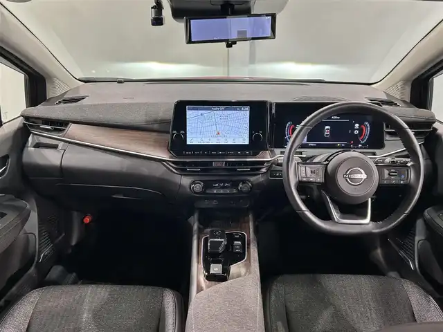 日産 オーラ G 愛知県 2023(令5)年 0.6万km ガーネットレッド/スーパーブラック 2トーン 純正９インチディスプレイナビ　/（Bluetooth/フルセグTV/CarPlay/USB/HDMI/AM/FM)/ＢＯＳＥサウンド　/プロパイロット　/ワイヤレス充電　/ＳＯＳコール　/アラウンドビューモニター　/エマージェンシーブレーキ　/ビルトインＥＴＣ２．０　/ドライブレコーダー　/デジタルインナーミラー　/ＬＥＤヘッドライト/LEDフォグランプ/ブラインドスポットモニター（BSW)/コーナーセンサー/車線逸脱警報/ハンドル支援/純正フロアマット
