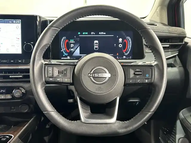日産 オーラ G 愛知県 2023(令5)年 0.6万km ガーネットレッド/スーパーブラック 2トーン 純正９インチディスプレイナビ　/（Bluetooth/フルセグTV/CarPlay/USB/HDMI/AM/FM)/ＢＯＳＥサウンド　/プロパイロット　/ワイヤレス充電　/ＳＯＳコール　/アラウンドビューモニター　/エマージェンシーブレーキ　/ビルトインＥＴＣ２．０　/ドライブレコーダー　/デジタルインナーミラー　/ＬＥＤヘッドライト/LEDフォグランプ/ブラインドスポットモニター（BSW)/コーナーセンサー/車線逸脱警報/ハンドル支援/純正フロアマット