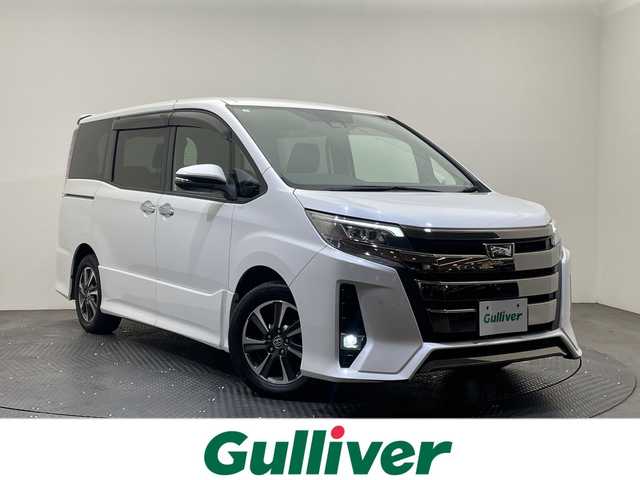 トヨタ ノア Si ダブルバイビーⅡ 愛媛県 2019(平31)年 7.6万km ホワイトパールクリスタルシャイン 純正9インチメモリナビ/(CD/DVD/BT/フルセグTV)/純正フリップダウンモニター/バックカメラ/両側パワースライドドア/ハーフレザーシート/スマートキー/プッシュスタート/ETC/電格ミラー/ウィンカーミラー/オートライト/フォグランプ/LEDヘッドライト/クルーズコントロール/クリアランスソナー/ドライブレコーダー/ステアリングスイッチ/革巻きステリング/純正16インチアルミホイール/ドアバイザー/純正フロアマット