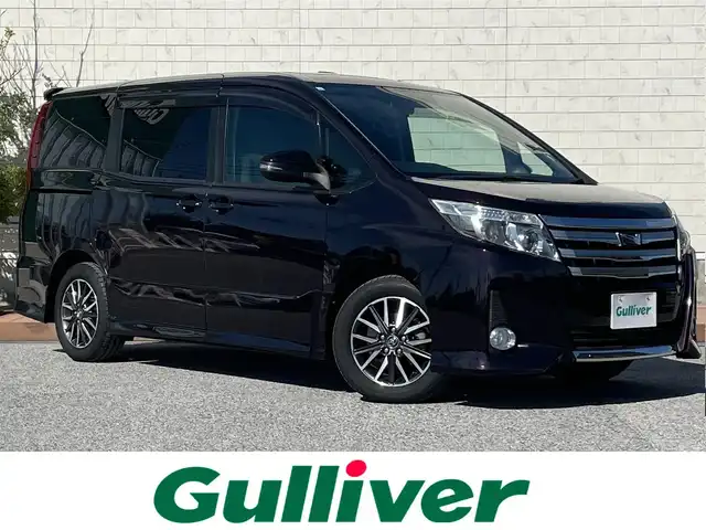 トヨタ ノア Si 滋賀県 2014(平26)年 6.6万km ボルドーマイカメタリック フリップダウンモニター/ツインムーンルーフ/両側パワースライドドア/7インチ純正ナビ【NSZN-W64T】/(FM/AM/CD/DVD/フルセグ/Bluetooth/HDMI)/ETC/バックカメラ/電動格納ミラー/アイドリングストップ/革巻きステアリング/ステアリングスイッチ/オートライト/キセノンライト/フロントフォグ/フルオートエアコン/プッシュスタート/スマートキー/純正フロアマット/ドアバイザー
