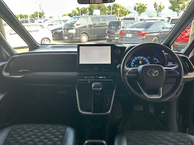 トヨタ ヴォクシー ハイブリッド S－Z 愛知県 2023(令5)年 3.2万km グリッターブラックガラスフレーク 純正10.5型ナビ/純正フリップダウンモニター/フルセグTV/バックカメラ/（BT/CD/DVD/HDMI)/プリクラッシュセーフティー/レーダークルーズコントロール/レーンディパーチャーアラート/クリアランスソナー/パーキングセンサー/ロードサインアシスト/横滑り防止装置/両側パワースライドドア/ビルトインETC/AC100V/リアサンシェード/LEDヘッドライト/オートライト/オートハイビーム