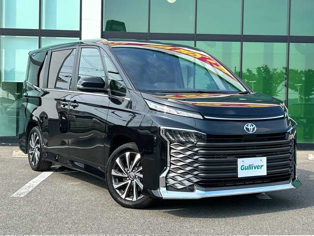 トヨタ ヴォクシー ハイブリッド S－Z 和歌山県 2023(令5)年 3.2万km グリッターブラックガラスフレーク 純正10.5型ナビ/純正フリップダウンモニター/フルセグTV/バックカメラ/（BT/CD/DVD/HDMI)/プリクラッシュセーフティー/レーダークルーズコントロール/レーンディパーチャーアラート/クリアランスソナー/パーキングセンサー/ロードサインアシスト/横滑り防止装置/両側パワースライドドア/ビルトインETC/AC100V/リアサンシェード/LEDヘッドライト/オートライト/オートハイビーム