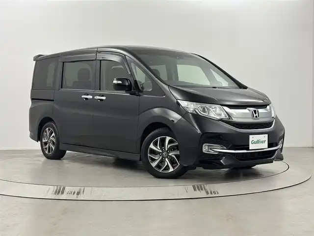 ホンダ ステップワゴン スパーダ ホンダセンシング 埼玉県 2016(平28)年 4.7万km プレミアムスパークルブラックパール ホンダセンシング/純正９インチメモリナビ(型式：VXM-165VFNi)/CD/DVD/Bluetooth/フルセグ/両側パワースライドドア/純正フリップダウンモニター/バックカメラ/ビルトインETC/ドライブレコーダー/レーンキープアシスト/社外レザー調シートカバー/純正１６インチAW/プッシュスタート/スマートキー/保証書・取説