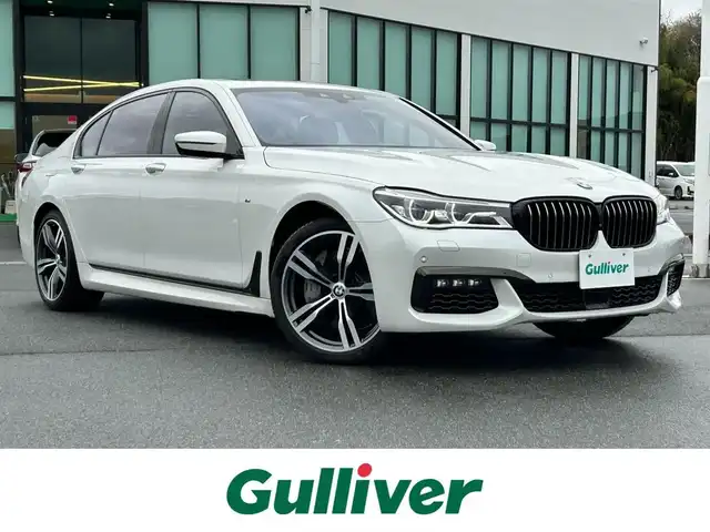 ＢＭＷ ７５０Ｌｉ Mスポーツ 奈良県 2018(平30)年 2.1万km 白 純正ナビ　/フルセグＴＶ　/BT/CD/DVD/全方位カメラ　/ドライブレコーダー　/ＢＳＭ/純正ＥＴＣ　/サンルーフ　/ハーマンカードン　/レザーシート　/全席シートヒーター　/全席エアシート　/全席パワーシート　/全席マッサージ機能付き/追従型クルーズコントロール/電動リアゲート/純正20インチアルミホイール/純正フロアマット/前後コーナーセンサー/ステアリングヒーター/全席ポジションメモリー/AUTOHOLD/リアサンシェード/LEDヘッドライト/オートライト/オートマチックハイビーム/レーンキープアシスト/衝突被害軽減システム/横滑り防止装置/盗難防止装置