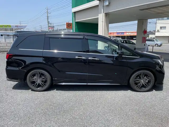 ホンダ オデッセイ ハイブリッド e:HEVアブソルート EX 茨城県 2021(令3)年 7.3万km プレミアムスパークルブラックパール ワンオーナー/純正10インチナビ（CD/DVD/BT/フルセグTV）/ETC2.0/純正フリップダウンモニター/純正エンジンスターター/前後ドライブレコーダー/アラウンドビューモニター/パワーバックドア/両側パワースライドドア/衝突軽減ブレーキ/車線逸脱/ブラインドスポットモニター/パーキングアシスト/レーダークルーズコントロール/プッシュスタート/D/N席シートヒーター/ステアリングスイッチ/LEDヘッドライト/純正フロアマット/バイザー
