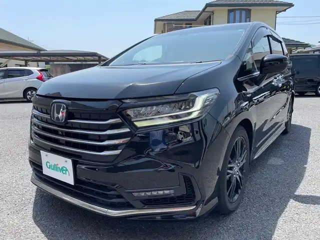 ホンダ オデッセイ ハイブリッド e:HEVアブソルート EX 茨城県 2021(令3)年 7.3万km プレミアムスパークルブラックパール ワンオーナー/純正10インチナビ（CD/DVD/BT/フルセグTV）/ETC2.0/純正フリップダウンモニター/純正エンジンスターター/前後ドライブレコーダー/アラウンドビューモニター/パワーバックドア/両側パワースライドドア/衝突軽減ブレーキ/車線逸脱/ブラインドスポットモニター/パーキングアシスト/レーダークルーズコントロール/プッシュスタート/D/N席シートヒーター/ステアリングスイッチ/LEDヘッドライト/純正フロアマット/バイザー