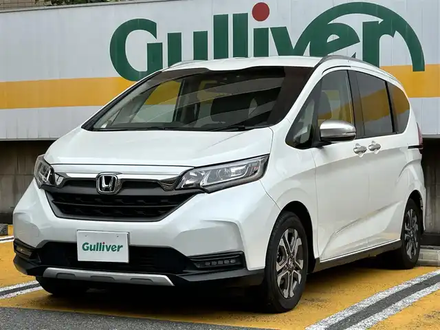 ホンダ フリード＋ クロスター ホンダセンシング 静岡県 2021(令3)年 4万km プラチナホワイトパール 社外8インチナビ/フルセグTV/DVD/CD/SD/MSV/BT/バックカメラ/両側パワースライドドア/ハーフレザーシート/衝突軽減ブレーキ/レーンキープアシスト/レーダークルーズコントロール/ビルトインETC/LEDヘッドライト/LEDフォグライト/ナビ連動前方ドライブレコーダー/ステアリングスイッチ/スマートキー×2/取扱説明書