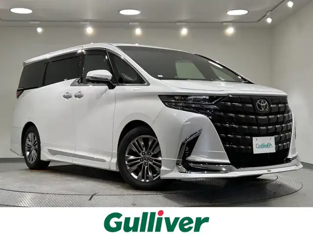 トヨタ アルファード Z 愛知県 2024(令6)年 1.2万km プラチナホワイトパールマイカ 純正１４インチディスプレイ/左右独立ムーンルーフ/モデリスタエアロ/トヨタチームメイト/パノラミックビューモニター/純正13.2インチフリップダウンモニター/ワイヤレス充電/パワーバックドア/レーダークルーズコントロール/両側電動スライドドア/後席電動シェード/シートヒーター/シートクーラー/シートメモリー/ハンドルヒーター/HDMI＆USB入力端子/ビルトインＥＴＣ2.0/前後ドライブレコーダー/アクセサリーソケット/オットマン/プリクラッシュセーフティ/フロント＆リアトラフィックアラート/レーンディパーチャーアラート/レーンチェンジアシスト/プロアクティブドライビングアシスト/ブラインドスポットモニター/パーキングサポートブレーキ/クリアランスソナー/安心降車アシスト
