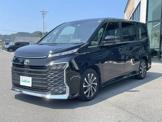 トヨタ ヴォクシー S－Z 愛媛県 2022(令4)年 2.5万km アティチュードブラックマイカ 10.5インチディスプレイオーディオ/（Bluetooth/CD/DVD/HDMI/AppleCarPlay/AndroidAuto/フルセグTV)/14型フリップダウンモニター/バックカメラ/両側パワースライドドア/ビルドインETC2.0/シートヒーター/アダプティブクルーズコントロール/純正17インチアルミホイール/LEDヘッドライト/オートマチックハイビーム/パーキングセンサー/プリクラッシュセーフティー/横滑り防止装置/レーンキープアシスト/盗難防止装置/スペアキー1本/プッシュスタート/スマートキー