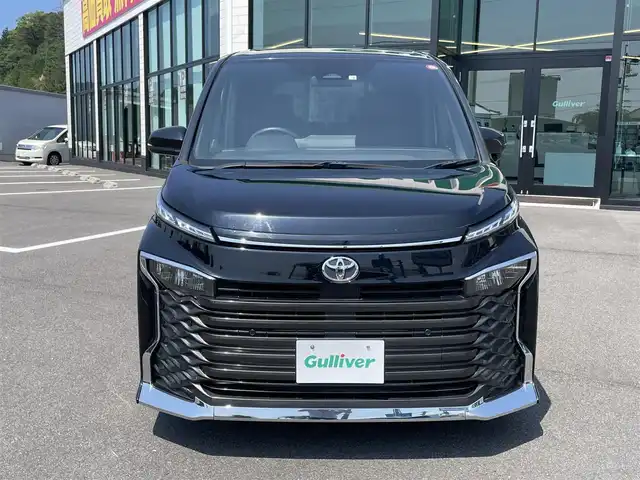 トヨタ ヴォクシー S－Z 愛媛県 2022(令4)年 2.5万km アティチュードブラックマイカ 10.5インチディスプレイオーディオ/（Bluetooth/CD/DVD/HDMI/AppleCarPlay/AndroidAuto/フルセグTV)/14型フリップダウンモニター/バックカメラ/両側パワースライドドア/ビルドインETC2.0/シートヒーター/アダプティブクルーズコントロール/純正17インチアルミホイール/LEDヘッドライト/オートマチックハイビーム/パーキングセンサー/プリクラッシュセーフティー/横滑り防止装置/レーンキープアシスト/盗難防止装置/スペアキー1本/プッシュスタート/スマートキー