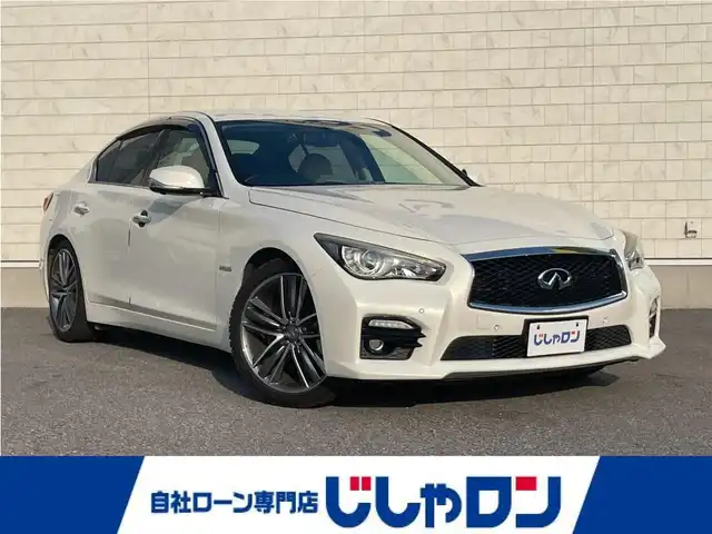日産 スカイライン ハイブリッド 350GT Type SP 栃木県 2014(平26)年 12.7万km クリスタルホワイトパール 株)IDOMが運営する【じしゃロン小山店】の自社ローン専用車両になります。こちらは現金またはオートローンご利用時の価格です。自社ローンご希望の方は別途その旨お申付け下さい//純正フルセグナビ/（CD/DVD/AM/FMラジオ）/(Bluetooth)/スマートキー/プッシュスタート/バックカメラ/オールアラウンドビュー/ＥＴＣ/インテリジェンスクルーズコントロール/レーンキープアシスト/車線逸脱警報/ドライブレコーダー/コーナーセンサー/パワーシート/シートヒーター/ステアリングリモコン/TPMS/ＢＯＳＥサウンドシステム/電動格納ドアミラー/パワーウインドウ/防眩ミラー/オートライト