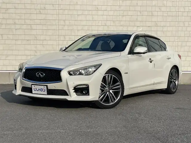 日産 スカイライン ハイブリッド 350GT Type SP 栃木県 2014(平26)年 12.7万km クリスタルホワイトパール 株)IDOMが運営する【じしゃロン小山店】の自社ローン専用車両になります。こちらは現金またはオートローンご利用時の価格です。自社ローンご希望の方は別途その旨お申付け下さい//純正フルセグナビ/（CD/DVD/AM/FMラジオ）/(Bluetooth)/スマートキー/プッシュスタート/バックカメラ/オールアラウンドビュー/ＥＴＣ/インテリジェンスクルーズコントロール/レーンキープアシスト/車線逸脱警報/ドライブレコーダー/コーナーセンサー/パワーシート/シートヒーター/ステアリングリモコン/TPMS/ＢＯＳＥサウンドシステム/電動格納ドアミラー/パワーウインドウ/防眩ミラー/オートライト