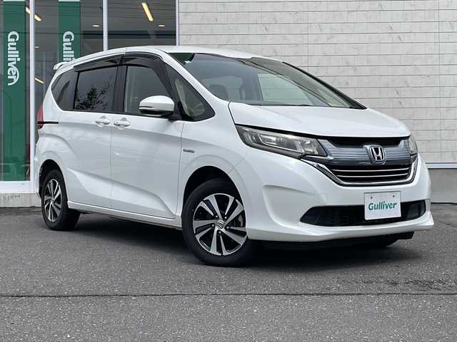 ホンダ フリード＋ ハイブリット G ホンダセンシング 岩手県 2016(平28)年 5.1万km ホワイトオーキッドパール 4WD/純正9インチメモリーナビ/ CD/DVD/Bluetooth/バックカメラ/両側パワースライドドア/HONDA SENSING/・アダプティブクルーズコントロール/・衝突軽減ブレーキ/・車線維持支援システム/・誤発進抑制機能/・先行車発進お知らせ機能/・オートハイビーム/・標識認識機能/ビルトインETC/横滑り防止装置/アイドリングストップ/シートヒーター/オートハイビーム/LEDオートヘッドライト/スマートキー/プッシュスタート/電動格納ミラー/純正15インチAW/純正フロアマット/ドアバイザー/保証書