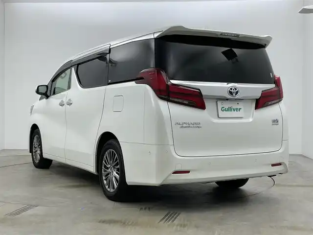トヨタ アルファードハイブリット エグゼクティブ ラウンジ 岡山県 2021(令3)年 4.5万km ホワイトパールクリスタルシャイン 10.5型純正SDナビ/（BTオーディオ/フルセグ）/JBLサウンドシステム/デジタルインナーミラー/パノラミックビューモニター/12.3インチフリップダウンモニター/ホワイトレザーシート/前席パワーシート/快適温熱シート/2列目エグゼクティブラウンジシート/・パワーリクライニング/・パワーオットマン/・快適温熱シート/ETC2.0/ドライブレコーダー/セーフティセンス/・プリクラッシュセーフティ/・レーントレーシングアシスト/・レーダークルーズコントロール/・BSM/パワーバックドア/両側パワースライドドア/ステアリングヒーター/純正フロアマット