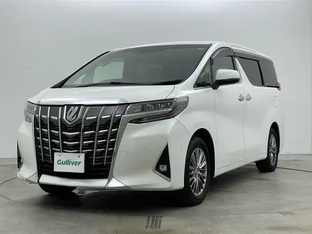 トヨタ アルファードハイブリット エグゼクティブ ラウンジ 岡山県 2021(令3)年 4.5万km ホワイトパールクリスタルシャイン 10.5型純正SDナビ/（BTオーディオ/フルセグ）/JBLサウンドシステム/デジタルインナーミラー/パノラミックビューモニター/12.3インチフリップダウンモニター/ホワイトレザーシート/前席パワーシート/快適温熱シート/2列目エグゼクティブラウンジシート/・パワーリクライニング/・パワーオットマン/・快適温熱シート/ETC2.0/ドライブレコーダー/セーフティセンス/・プリクラッシュセーフティ/・レーントレーシングアシスト/・レーダークルーズコントロール/・BSM/パワーバックドア/両側パワースライドドア/ステアリングヒーター/純正フロアマット