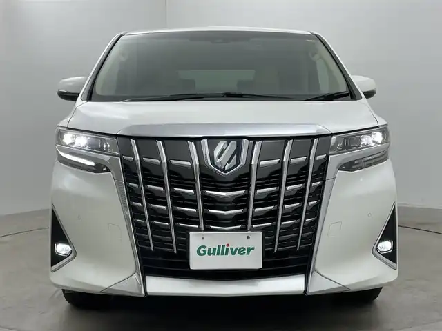 トヨタ アルファードハイブリット エグゼクティブ ラウンジ 岡山県 2021(令3)年 4.5万km ホワイトパールクリスタルシャイン 10.5型純正SDナビ/（BTオーディオ/フルセグ）/JBLサウンドシステム/デジタルインナーミラー/パノラミックビューモニター/12.3インチフリップダウンモニター/ホワイトレザーシート/前席パワーシート/快適温熱シート/2列目エグゼクティブラウンジシート/・パワーリクライニング/・パワーオットマン/・快適温熱シート/ETC2.0/ドライブレコーダー/セーフティセンス/・プリクラッシュセーフティ/・レーントレーシングアシスト/・レーダークルーズコントロール/・BSM/パワーバックドア/両側パワースライドドア/ステアリングヒーター/純正フロアマット