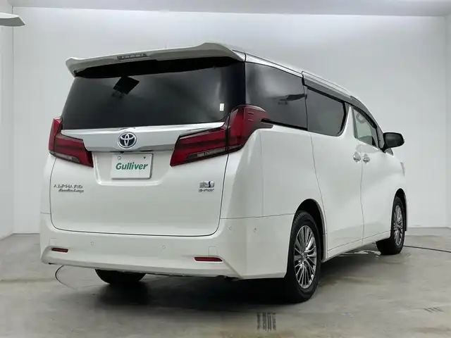 トヨタ アルファードハイブリット エグゼクティブ ラウンジ 岡山県 2021(令3)年 4.5万km ホワイトパールクリスタルシャイン 10.5型純正SDナビ/（BTオーディオ/フルセグ）/JBLサウンドシステム/デジタルインナーミラー/パノラミックビューモニター/12.3インチフリップダウンモニター/ホワイトレザーシート/前席パワーシート/快適温熱シート/2列目エグゼクティブラウンジシート/・パワーリクライニング/・パワーオットマン/・快適温熱シート/ETC2.0/ドライブレコーダー/セーフティセンス/・プリクラッシュセーフティ/・レーントレーシングアシスト/・レーダークルーズコントロール/・BSM/パワーバックドア/両側パワースライドドア/ステアリングヒーター/純正フロアマット