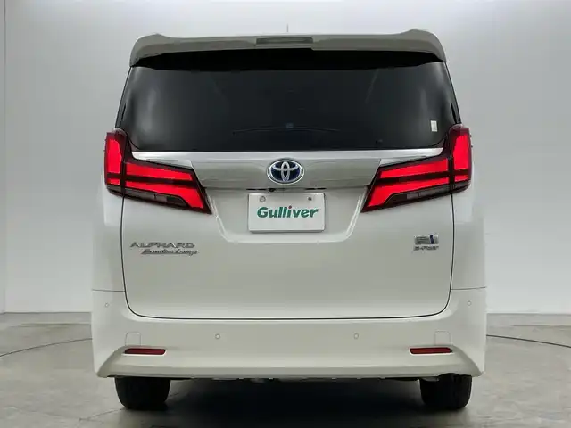 トヨタ アルファードハイブリット エグゼクティブ ラウンジ 岡山県 2021(令3)年 4.5万km ホワイトパールクリスタルシャイン 10.5型純正SDナビ/（BTオーディオ/フルセグ）/JBLサウンドシステム/デジタルインナーミラー/パノラミックビューモニター/12.3インチフリップダウンモニター/ホワイトレザーシート/前席パワーシート/快適温熱シート/2列目エグゼクティブラウンジシート/・パワーリクライニング/・パワーオットマン/・快適温熱シート/ETC2.0/ドライブレコーダー/セーフティセンス/・プリクラッシュセーフティ/・レーントレーシングアシスト/・レーダークルーズコントロール/・BSM/パワーバックドア/両側パワースライドドア/ステアリングヒーター/純正フロアマット