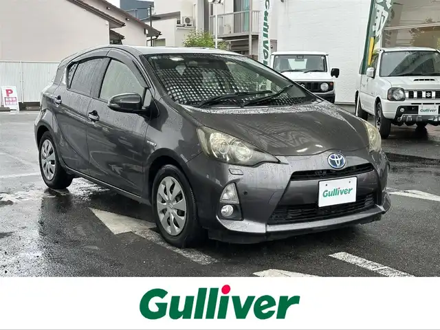 トヨタ アクア S 愛知県 2013(平25)年 14.5万km グレーメタリック ワンオーナー/SDナビ/フルセグテレビ/バックカメラ/アイドリングストップ/ウィンカーミラー/ドアバイザー/プッシュスタート/ETC/AAC/Bluetooth/純正フロアマット/前後コーナーセンサー/オートライト/ステアリングスイッチ/車両接近警報オフ切り替えスイッチ/ヘッドライトクリーナースイッチ/保証書/取扱説明書/スマートキー2本