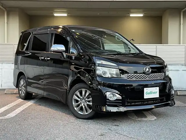 トヨタ ヴォクシー ZS 煌 大阪府 2010(平22)年 5.3万km ブラック ワンオーナー/禁煙車/純正ナビ【NHZN-W60G】/　フルセグTV/Bluetooth/CD/DVD/FM/AM/AUX/バックカメラ/10.2インチALPINE後席モニター【TMX-R2200】/デジタルインナーミラー型ドライブレコーダー【DMDR-28】/ドライブレコーダー【NX-DR200S】/ETC/パドルシフト/ステアリングスイッチ/革巻きステアリング/HIDヘッドライト/フォグランプ/ウィンカーミラー/スペアキー/記録簿：H25/26/27/29/R1/2年分あり