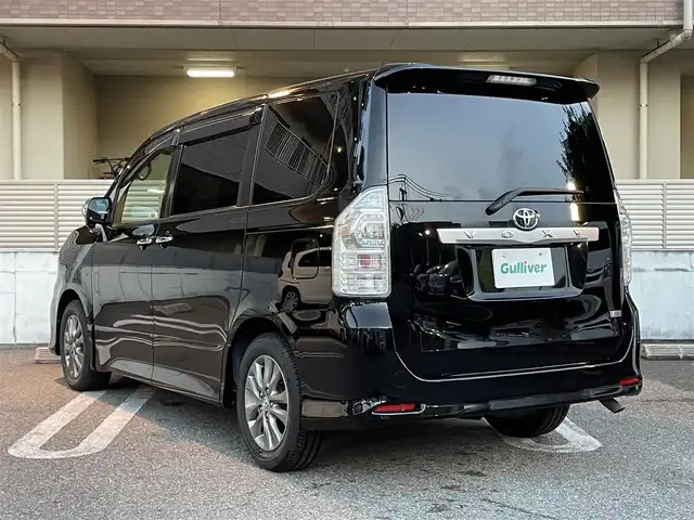 トヨタ ヴォクシー ZS 煌 大阪府 2010(平22)年 5.3万km ブラック ワンオーナー/禁煙車/純正ナビ【NHZN-W60G】/　フルセグTV/Bluetooth/CD/DVD/FM/AM/AUX/バックカメラ/10.2インチALPINE後席モニター【TMX-R2200】/デジタルインナーミラー型ドライブレコーダー【DMDR-28】/ドライブレコーダー【NX-DR200S】/ETC/パドルシフト/ステアリングスイッチ/革巻きステアリング/HIDヘッドライト/フォグランプ/ウィンカーミラー/スペアキー/記録簿：H25/26/27/29/R1/2年分あり