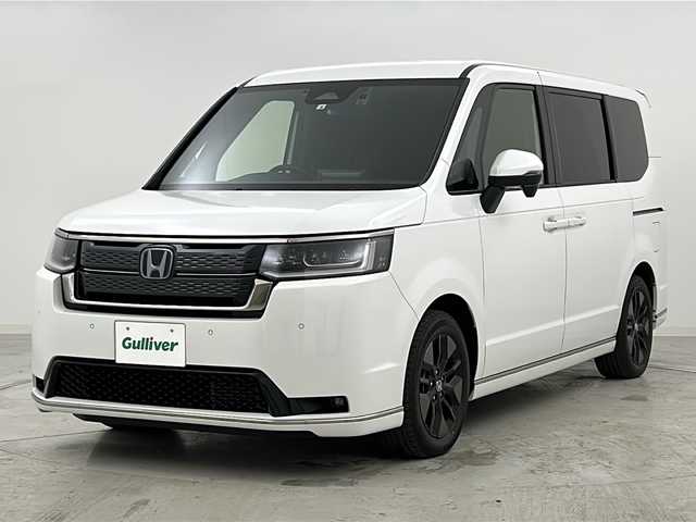 ホンダ ステップワゴン スパーダ eHEV 愛知県 2022(令4)年 3.1万km プラチナホワイトパール Honda SENSING/・衝突軽減ブレーキ/・アダプティブクルーズコントロール/・車線維持支援システム/・ブラインドスポットインフォメーション/・パーキングセンサーシステム/・オートハイビーム/純正11.4インチナビ/・CD.DVD.USB.BT/フルセグTV/バックカメラ/両側パワースライドドア/パワーバックドア/ハーフレザーシート/前席シートヒーター/シーケンシャルランプ/LEDヘッドライト/LEDフォグランプ/パドルシフト/ビルトインETC/純正ドラレコ（F）/横滑り防止/プッシュスタート/スマートキー/純正16インチAW/純正フロアマット/ロールサンシェード/シートバックテーブル/シート背面USB
