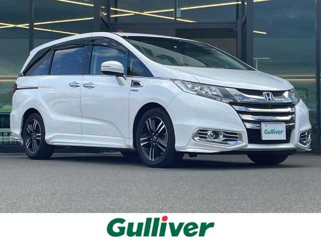 ホンダ オデッセイ ハイブリッド アブソルートセンシングアドバンP 東京都 2016(平28)年 4.9万km ホワイトオーキッドパール ホンダセンシング/衝突軽減ブレーキ/アダプティブクルーズコントロール/メーカーナビ/CD/DVD/BT/AM/FM/USB/HDMI/AppleCarplay/マルチビューモニター/両側パワースライドドア/運転席パワーシート（8ウェイ）/ハーフレザーシート/2列目サンシェード/ビルトインETC/LEDヘッドライト