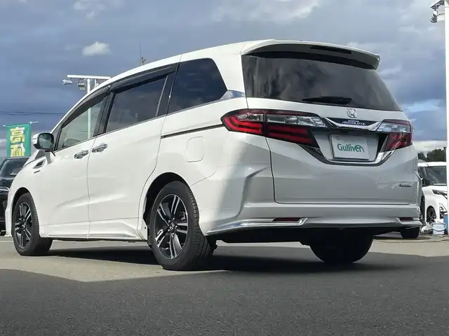 ホンダ オデッセイ ハイブリッド アブソルートセンシングアドバンP 東京都 2016(平28)年 4.9万km ホワイトオーキッドパール ホンダセンシング/衝突軽減ブレーキ/アダプティブクルーズコントロール/メーカーナビ/CD/DVD/BT/AM/FM/USB/HDMI/AppleCarplay/マルチビューモニター/両側パワースライドドア/運転席パワーシート（8ウェイ）/ハーフレザーシート/2列目サンシェード/ビルトインETC/LEDヘッドライト