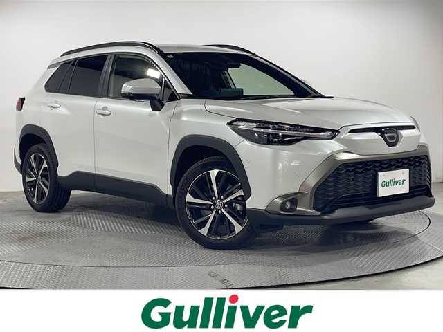 トヨタ カローラ クロス ハイブリッド Z 広島県 2024(令6)年 0.4万km プラチナホワイトパールマイカ 禁煙車/純正10.5型ディスプレイオーディオ/全周囲カメラ/シートヒーター/電動リアゲート/パーキングアシスト/レーダークルーズコントロール/ドラレコ/ＥＴＣ２．０/パワーシート/ブラインドスポットモニター/オートマチックハイビーム/エアバッグ(運転席/助手席/サイド/カーテン)/純正18インチアルミホイール(225/50/R18)