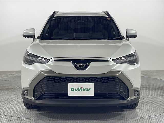 トヨタ カローラ クロス ハイブリッド Z 広島県 2024(令6)年 0.4万km プラチナホワイトパールマイカ 禁煙車/純正10.5型ディスプレイオーディオ/全周囲カメラ/シートヒーター/電動リアゲート/パーキングアシスト/レーダークルーズコントロール/ドラレコ/ＥＴＣ２．０/パワーシート/ブラインドスポットモニター/オートマチックハイビーム/エアバッグ(運転席/助手席/サイド/カーテン)/純正18インチアルミホイール(225/50/R18)