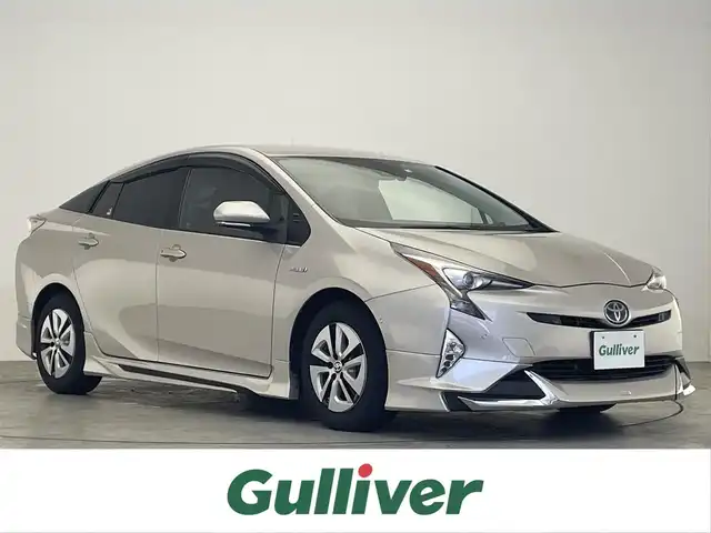 トヨタ プリウス A プレミアム 滋賀県 2016(平28)年 5.4万km スティールブロンドM 禁煙車/純正9型ナビ/CD.DVD.Bluetooth.フルセグ/バックカメラ/トヨタセーフティセンス/・プリクラッシュセーフティ/・レーンディパーチャーアラート/・オートマチックハイビーム/・レーダークルーズコントロール/LEDヘッドライト/前席シートヒーター/D席パワーシート/本革黒シート/ヘッドアップディスプレイ/クリアランスソナー/ブラインドスポットモニター/社外エアロ/パーキングアシスト/純正前方ドライブレコーダー/ビルトインETC