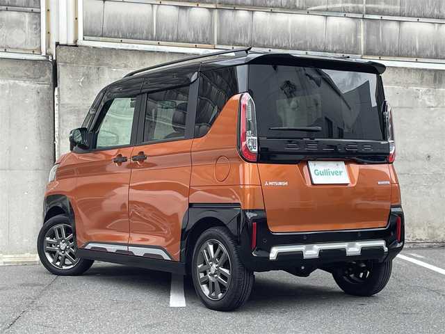 三菱 デリカミニ T 愛知県 2023(令5)年 1万km オレンジⅡ 4WD/合皮ハーフレザーシート/純正９型ナビゲーション/Bluetooth・フルセグテレビ/ハンズフリー両側パワースライドドア/アダクティブLEDヘッドライト/フォグライト/オートライト/社外前後ドラレコ（CS-72FH)/衝突軽減ブレーキ/車線逸脱警報/速度標識認識機能/エクシードバイザー/ヒルディセントコントロール/インパネトレイマット/ステアリングスイッチ/前席シートヒーター/パドルシフト/クリアランスソナー/ルーフレール/サイドデカール/ダイナミックシールドブラック/テールゲートガーニッシュブラック/サイドデカール/エクシードバイザー/ルーフレール/スマートキー/プッシュスタート/オールウェザー用純正フロアマット/アームレストコンソールブラック/保証書/取扱説明書/スペアスマートキー