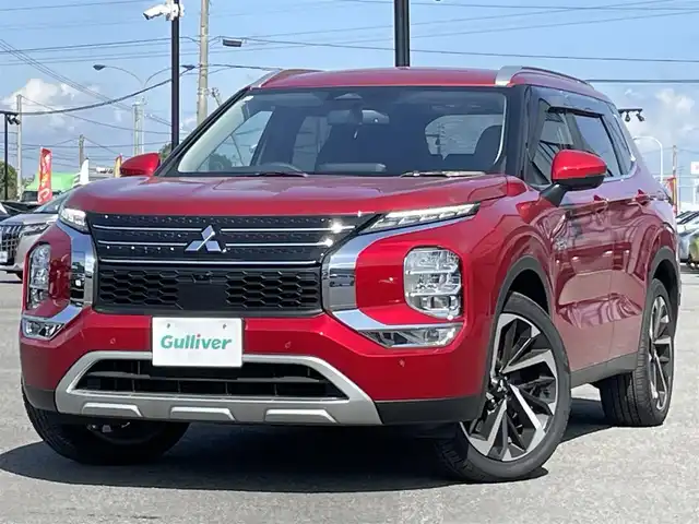 三菱 アウトランダー ＰＨＥＶ G 道央・札幌 2024(令6)年 0.3万km レッドダイヤモンド ４WD/プラグインハイブリッド/寒冷地仕様/純正メーカーナビ/AM/FM/BT/フルセグ/マイパイロット/衝突被害軽減ブレーキ/横滑り防止装置/アダプティブクルーズコントロール/レーンキープアシスト/パーキングセンサー/ブラインドスポットモニター/アラウンドビューモニター/ビルトインETC2.0/自動防眩ミラー/EVMODE/DRIVEMODE切替/パワーバックドア/D席パワーシート/前席シートヒーター/ハーフレザーシート/革巻きステアリング/ステアリングリモコン/パドルシフト/ハンドルヒーター/AC1500W/電動パーキング/オートブレーキホールド/置くだけ充電/プッシュスタート/スマートキー/LEDヘッドライト/オートライト/オートハイビーム/フォグランプ/電動格納ミラー/ウィンカーミラー/純正フロアマット/ドアバイザー/スペアキー
