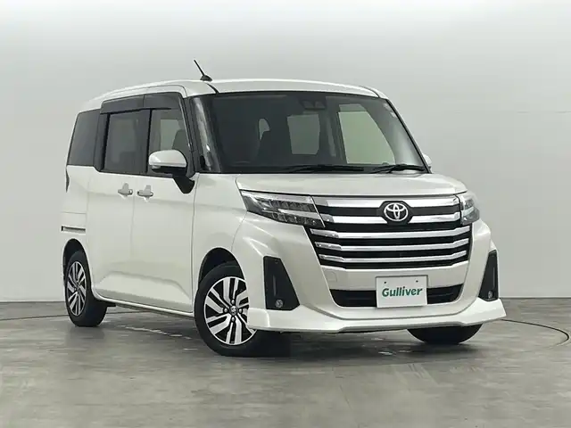 トヨタ ルーミー カスタムG 福島県 2023(令5)年 2.6万km パールホワイトⅢ トヨタセーフティセンス/・オートマチックハイビーム/・標識認識機能/・衝突回避ブレーキ/・車線逸脱防止機能/・衝突被害軽減システム/・盗難防止装置/・前後コーナーセンサー/純正7インチメモリーナビ/・型番；NMZK-W73D/・フルセグ/TV/BT/USB/CD/DVD/iPod/AM/FM/全方位カメラ/両側パワースライドドア/レーダークルーズコントロール/LEDオートライト/・フォグランプ/シートヒーター/純正アルミホイール付きサマータイヤ/PWRモード/アイドリングストップ/電子パーキング/・オートブレーキホールド/電動格納ミラー/・ウィンカーミラー/ETC/ドアバイザー/純正フロアマット/社外センターコンソール/コンフォートパッケージ/プッシュスタート/・スマートキー/・スペアキー