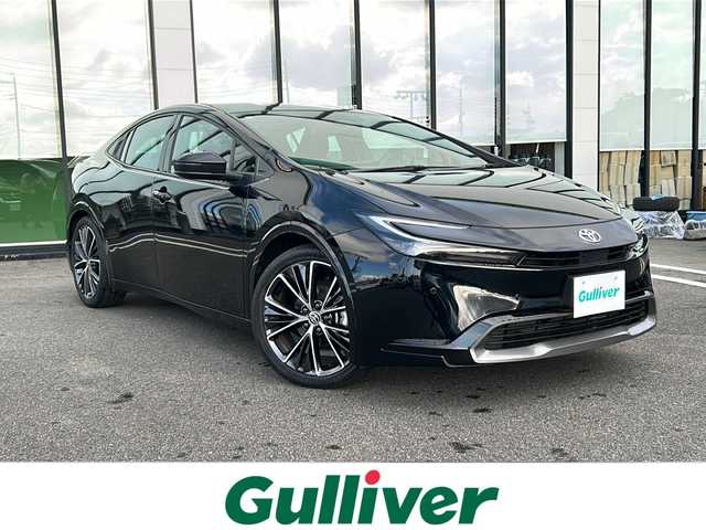 トヨタ プリウス Z 岐阜県 2024(令6)年 1.7万km アティチュードブラックマイカ 登録時走行距離16275km/ディスプレイオーディオ　/フルセグテレビ　/全方位カメラ　/ガラスルーフ　/コーナーセンサー前後　/電動リアゲート　/ETC2.0/ＬＥＤヘッドライト　/レーダークルーズ　/レザーシート　/パワーシート前席　/シートヒーター前席/エアシート前席/フルフラットシート/プッシュスタート/取扱説明書/パワーウィンドウ/パワーステアリング/スマートキー/エアコンAAC/Blue tooth可/USB入力端子/ドライブレコーダー前後/純正フロアマット/純正19アルミホイール/ABS/横滑り防止装置/盗難防止装置/レーンキープアシスト/オートライト/オートマチックハイビーム/エアバッグW/衝突被害軽減システム/ステアリングヒーター