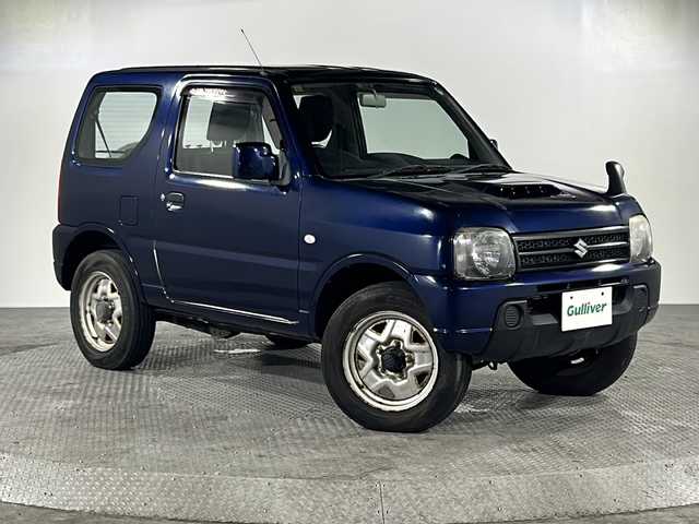スズキ ジムニー XG 沖縄県 2012(平24)年 3.2万km ノクターンブルーパール 禁煙車/４ＷＤ/ワンオーナー/社外オーディオ/ＣＤ／ラジオ　/リモコンキー/ターボ/背面タイヤ/純正フロアマット/純正ドアバイザー/フェンダーミラー/横滑り防止装置/スペアキー/取扱説明書/保証書