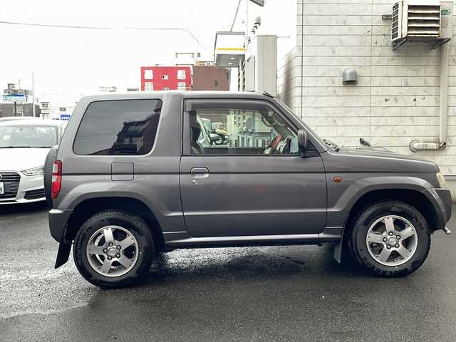 日産 キックス RX 道央・札幌 2009(平21)年 7.2万km ミディアムグレー 社外ナビ(BT、FM、AM、TV、SD、CD)/純正ドアバイザー/シートヒーター(運転席)/ETC/オートライト/純正エンジンスターター/バックカメラ/背面タイヤ