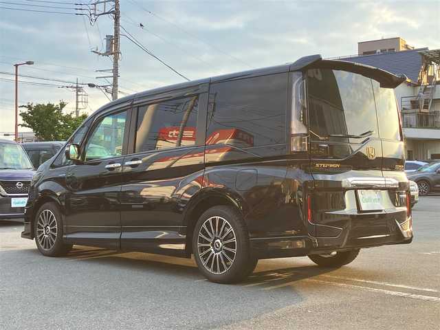 ホンダ ステップワゴン スパーダ ハイブリッドG EX HセンシングBスタイ 静岡県 2019(令1)年 5.8万km プレミアムスパークルブラックパール エンジンスタートボタン/パワーステアリング/パワーウィンドウ/100V充電/アイドリングストップ/スマートキー/Wオートエアコン/クルーズコントロール（追従有）/フリップダウンモニター/USB入力端子/ETC/バックカメラ/純正9インチメモリナビ（CD/BT/フルセグ）/三列シート/ウォークスルー/無限フロアマット/無限17インチアルミホイール/ハーフレザーシート/D席N席シートヒーター/両側パワースライドドア/フロント/サイドエアロ/ABS/横滑り防止装置/レーンキープアシスト/オートライト/LEDヘッドライト/W+サイドエアバック/カーテンエアバック/衝突軽減システム